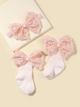 rosa strumpor spädbarn, hårband spädbarn, tryckfritt hårband, spädbarnsaccessoarer, eleganta bebiskläder, rosa rosetter, present till nyfödd, stilfull bebisgarderob